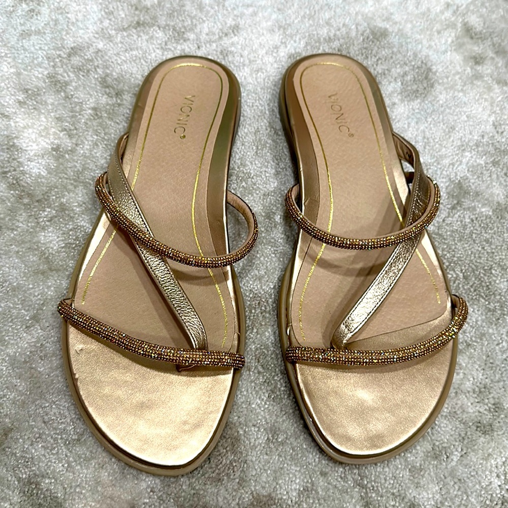 Gold Vionic sandals with crystals